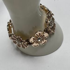 rose gold tone stretch bracelet with rhinestone centers costume jewelry